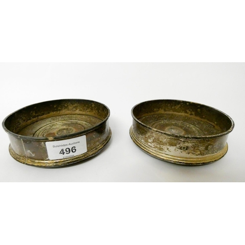 496 - A pair of modern silver bottle coasters, London 1988. 12.5 cms diameter