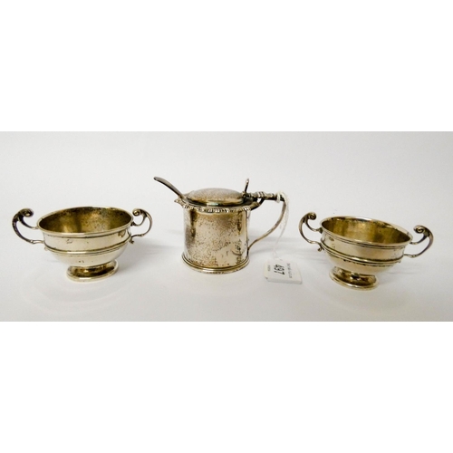 497 - A pair of silver twin handled salt cellars and a silver mustard with blue glass liner and silver spo... 