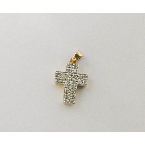 550 - A diamond cross pendant, pave set with brilliant cut diamonds of 0.25 carats, on 9ct yellow gold. 2.... 