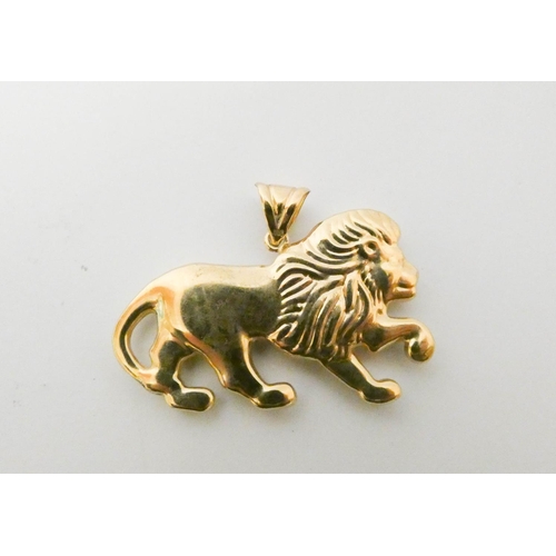 415 - A gold Lion charm pendant, 4.5 cms across, loop marked 9ct gold, weight 5.2g