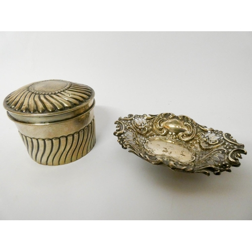 463 - A cylindrical silver tea caddy with gilded interior and a pierced silver bon bon dish. Gross weight ... 