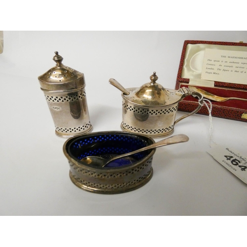 464 - A silver replica Maidenhead spoon in case and a silver three piece cruet set with pierced decoration... 