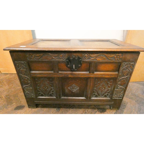 339 - A Victorian carved dark oak panel coffer with iron lock, 3'6 wide