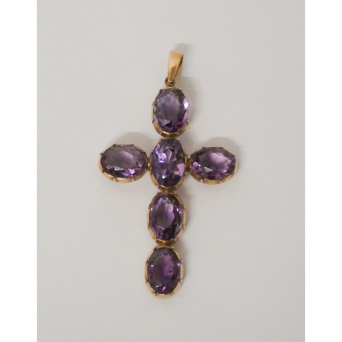 458 - A 19th century amethyst cross pendant, claw set in 9ct rose  gold, 6 cms long including suspension l... 