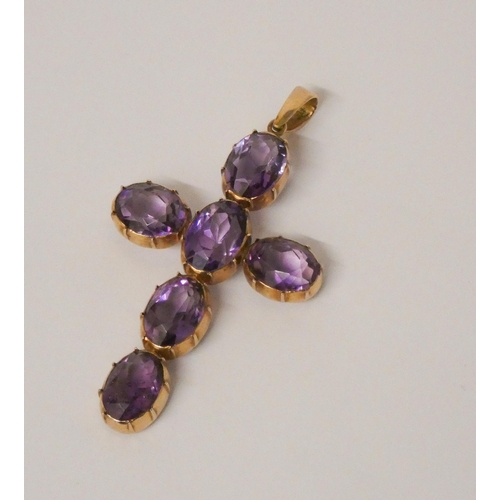 458 - A 19th century amethyst cross pendant, claw set in 9ct rose  gold, 6 cms long including suspension l... 