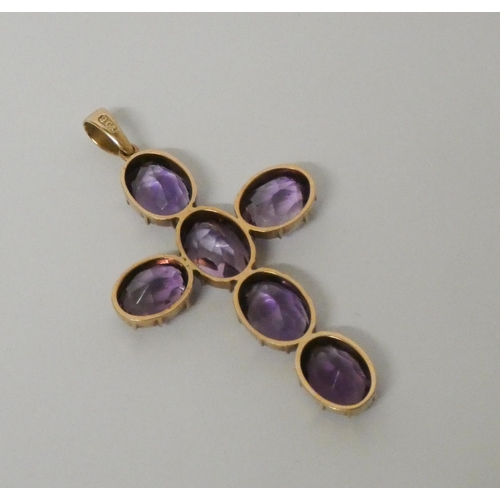 458 - A 19th century amethyst cross pendant, claw set in 9ct rose  gold, 6 cms long including suspension l... 