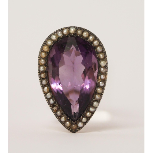 459 - A 19th century amethyst and seed pearl tea drop shaped ring, on unmarked rose gold metal. Ring size ... 