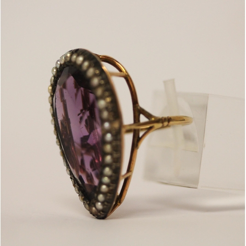 459 - A 19th century amethyst and seed pearl tea drop shaped ring, on unmarked rose gold metal. Ring size ... 