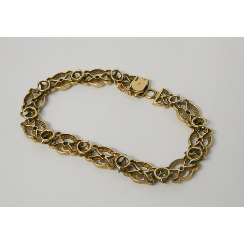 519 - An emerald and diamond bracelet, comprised of 9ct yellow gold openwork links 20cms long. Hallmarked,... 