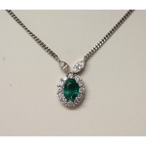 521 - A platinum emerald and diamond necklace, the cluster pendant, of oval shape  to platinum chain. Hall... 