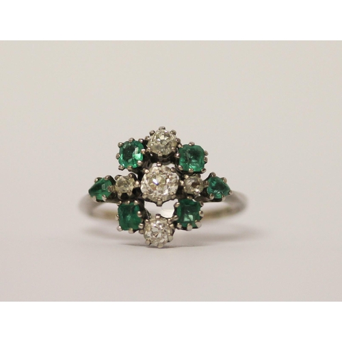 522 - Art deco emerald and diamond ring designed as a stylised geometric cluster, on platinum band, band m... 