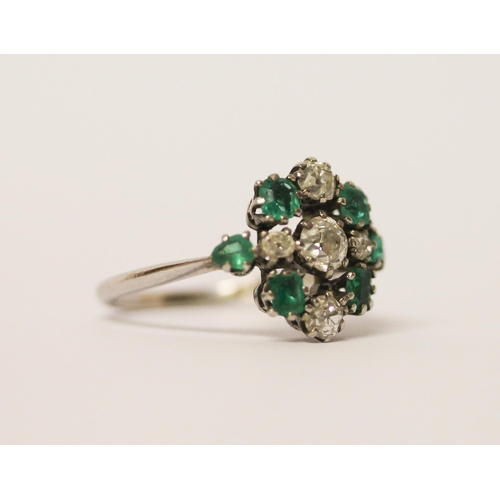 522 - Art deco emerald and diamond ring designed as a stylised geometric cluster, on platinum band, band m... 