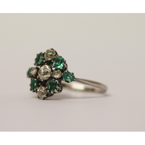 522 - Art deco emerald and diamond ring designed as a stylised geometric cluster, on platinum band, band m... 