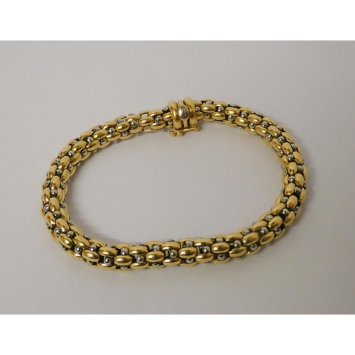 559 - Fope - Flex'it bracelet in 18ct white and yellow gold, 19.5 cms long, gross weight 20.9 grams