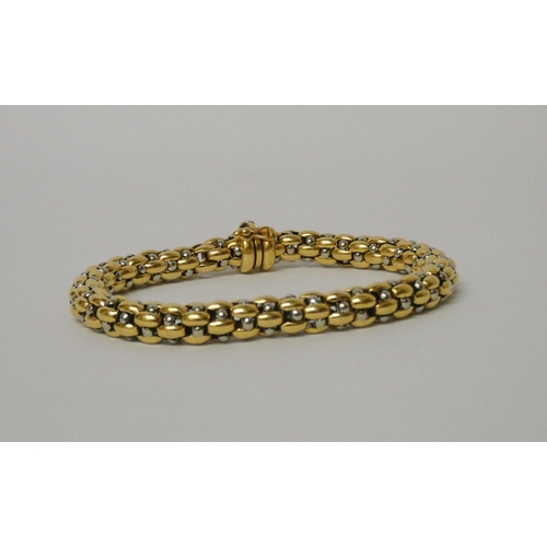 559 - Fope - Flex'it bracelet in 18ct white and yellow gold, 19.5 cms long, gross weight 20.9 grams