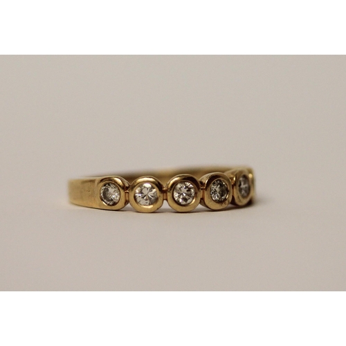 564 - A modern half hoop diamond eternity ring, set seven brilliant cut diamonds in rub over settings on 1... 