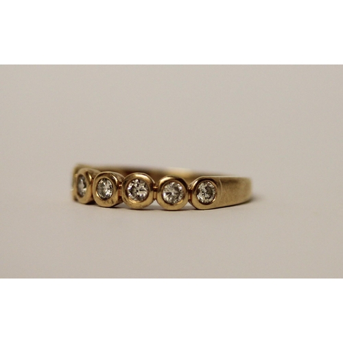 564 - A modern half hoop diamond eternity ring, set seven brilliant cut diamonds in rub over settings on 1... 