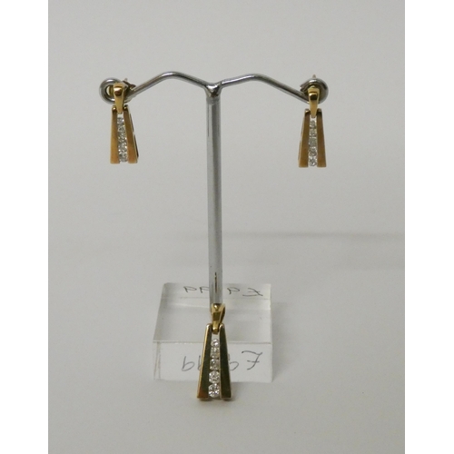 565 - A diamond pendant and matching drop earrings, in 9ct yellow gold, gross weight 3.5g