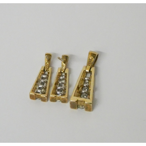 565 - A diamond pendant and matching drop earrings, in 9ct yellow gold, gross weight 3.5g