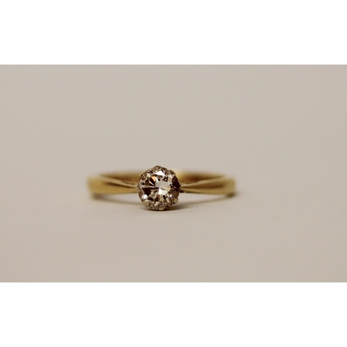 567 - A solitaire diamond ring, the claw set circular diamond on an 18ct  yellow gold band, hallmarked, ri... 