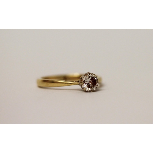 567 - A solitaire diamond ring, the claw set circular diamond on an 18ct  yellow gold band, hallmarked, ri... 