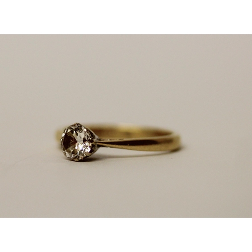 567 - A solitaire diamond ring, the claw set circular diamond on an 18ct  yellow gold band, hallmarked, ri... 