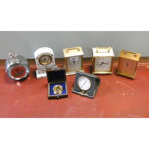 580 - A collection of mantle clocks to include a reproduction Leica Bullseye clock and compass etc