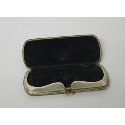 408 - A silver spectacles case, hallmarked Birmingham 1920, 11 cms across...