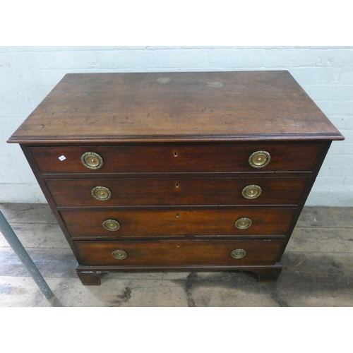 1 - A Georgian mahogany chest of four long drawers with brass ring handles, 38