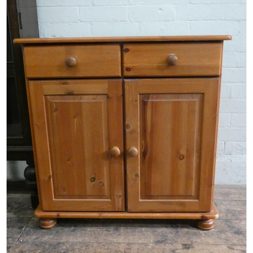 24 - A small modern pine sideboard, fitted two drawers and cupboards, 2'6 wide