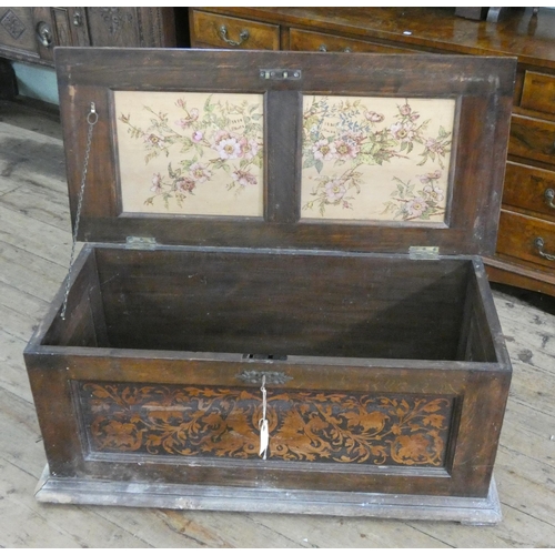 4 - An oak blanket chest with floral inlaid marquetry panels, 40