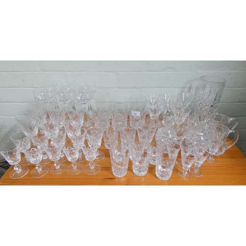 41 - A quantity of assorted cut wine glasses, vase, jugs, decanters etc