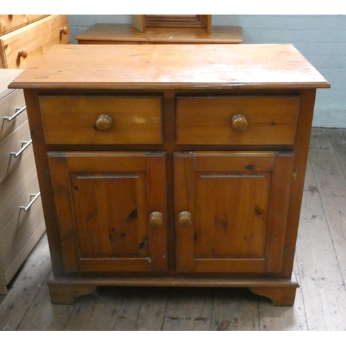 48 - A small modern pine sideboard fitted drawers and cupboards, 3' wide and a pine three drawer bedside ... 