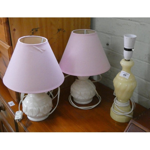 49 - A pair of white marble table lamps with shades and one odd lamp and a long wall mirror in decorative... 