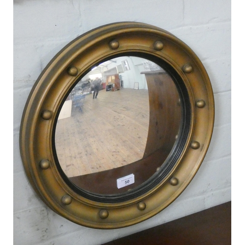 50 - A circular convex wall mirror in gilt frame, 16