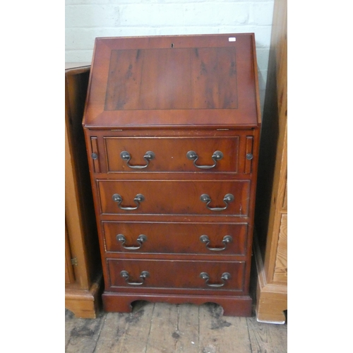 52 - A small reproduction yew wood ladies bureau with four drawers under, 20