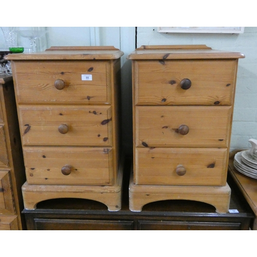 55 - A pair of pine three drawer bedside chests