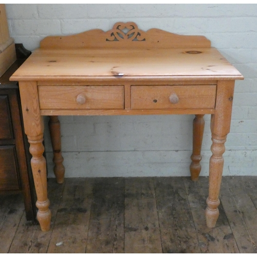 61 - A pine hall table fitted two drawers on turned legs, 3' wide