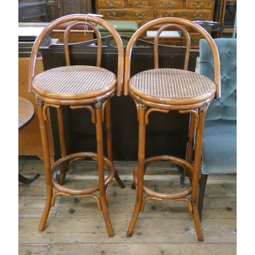 86 - A pair of Bentwood high stools with cane seats