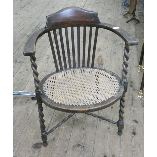 94 - An oak barley twist framed oval tub shaped elbow chair