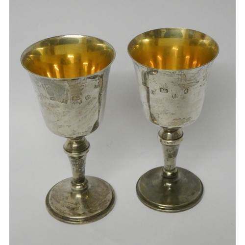 401 - A pair of modern silver gilt modern goblets, height 15cms, shallow presentation engraving, hallmarke... 