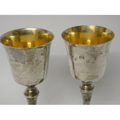 401 - A pair of modern silver gilt modern goblets, height 15cms, shallow presentation engraving, hallmarke... 