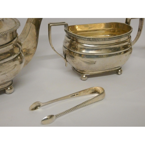 402 - A three piece silver tea service, Sheffield 1930's, William Hutton & Sons, with a pair of silver sug... 