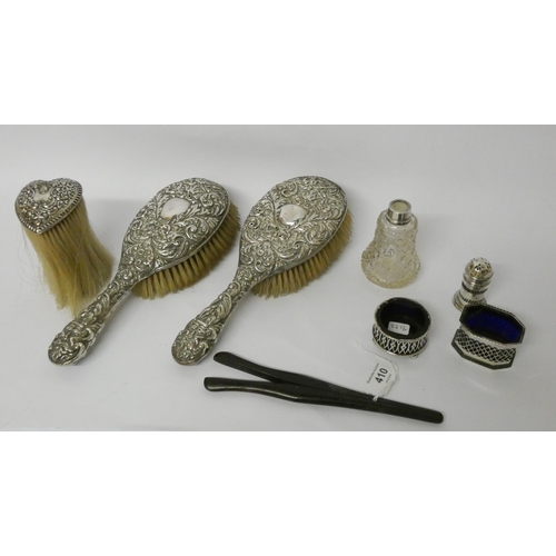 410 - Silver backed hairbrush set, condiments and a silver topped scent bottle.