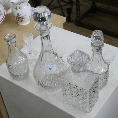 95 - Four various glass decanters and eight small wine glasses