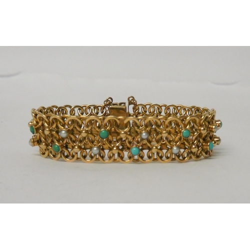 447 - A wide 9ct gold flexible link panel bracelet set with turquoise cabochons and seed pearls, clasp hal... 