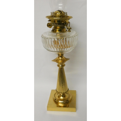 200 - A Victorian brass oil lamp with cut glass reservoir