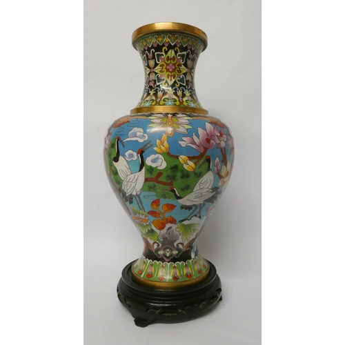 201 - A polychrome Chinese cloisonné enamelled vase on stand, 37cms tall including the base