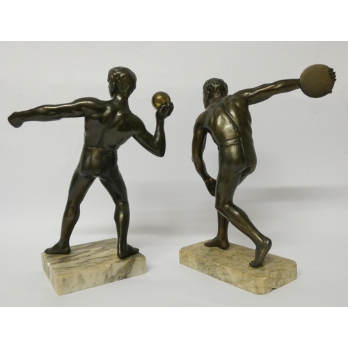 202 - A pair of decorative spelter figures of athletes after the antique, standing on square onyx bases, e... 