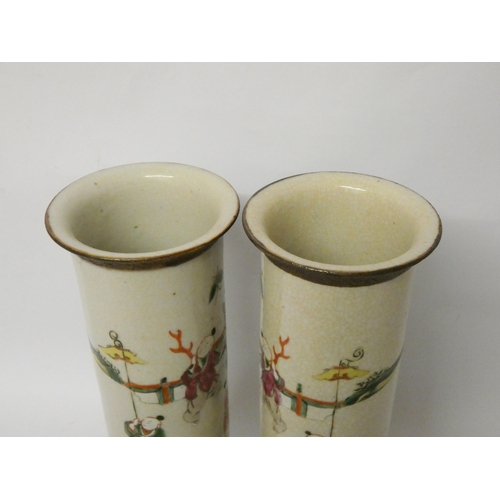 203 - A pair of Japanese crackle ware cylindrical vases, character marks on the base, height 31cms tall